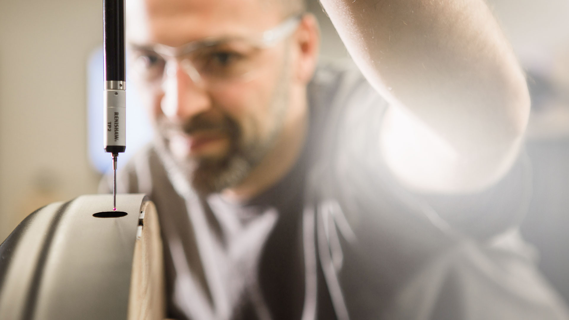 A Hampel engineer measuring a part with a height gauge